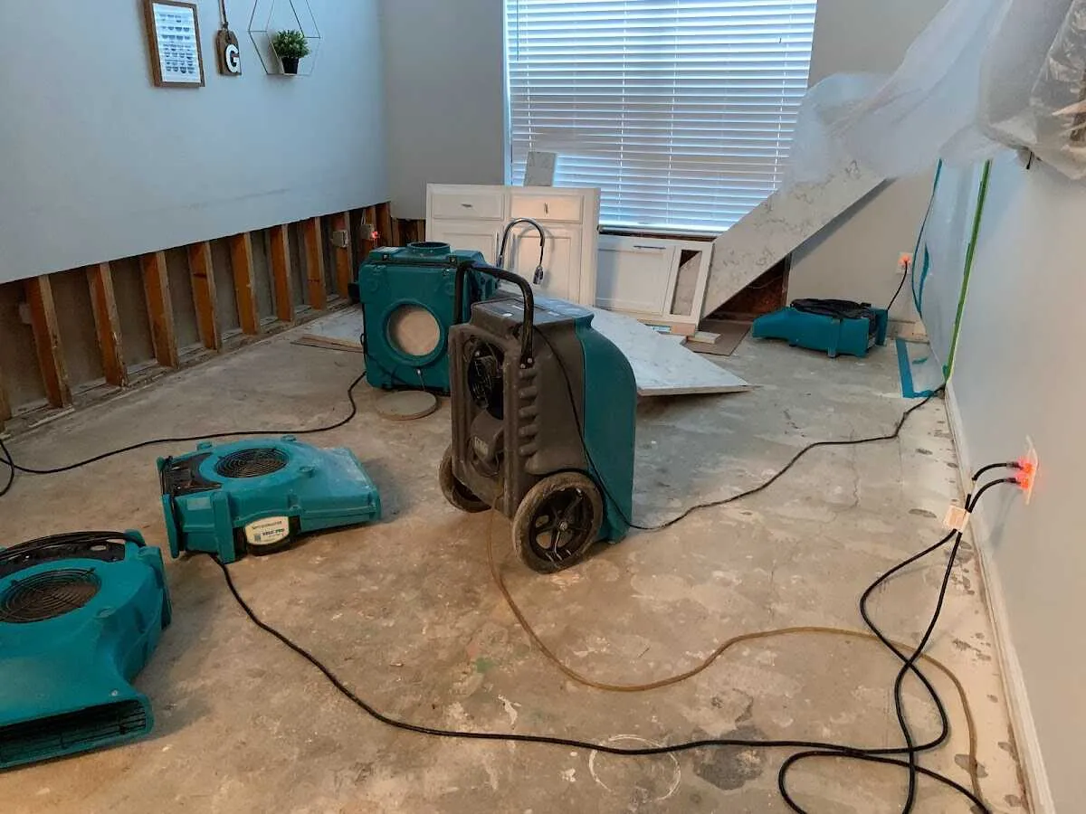 Dehumidifier in flood-cut room for Water Damage Restoration in Durham